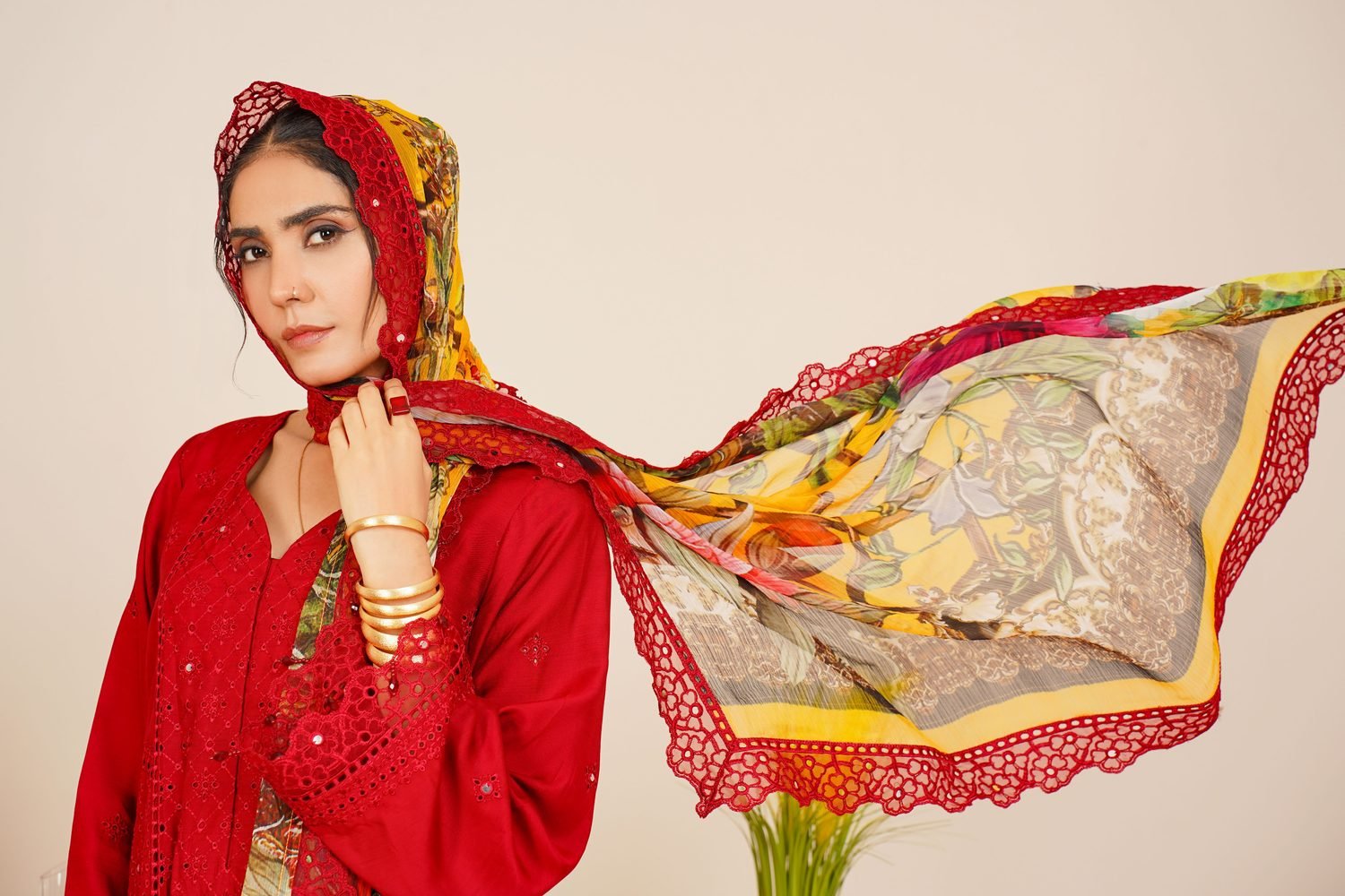 Model in a red kurta with a printed floral dupatta